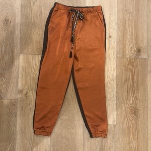 Anthropologie Eva Franco satin joggers - size small -black & copper